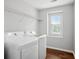 This laundry room features a window for natural light at 2840 Brookford Sw Ln, Atlanta, GA 30331