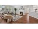 Cozy living room with hardwood floors, fireplace, and lots of natural light at 2840 Brookford Sw Ln, Atlanta, GA 30331