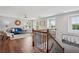 Upstairs living room with abundant light, modern decor, and wood floors at 2840 Brookford Sw Ln, Atlanta, GA 30331