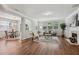 Spacious living room with hardwood floors, fireplace, large windows, and elegant furniture at 2840 Brookford Sw Ln, Atlanta, GA 30331