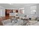 Living room with hardwood floors, open floor plan, and view of a modern kitchen at 2840 Brookford Sw Ln, Atlanta, GA 30331