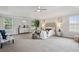 Expansive main bedroom boasts tray ceilings, neutral decor, and lots of natural light at 2840 Brookford Sw Ln, Atlanta, GA 30331
