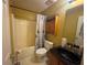 Functional bathroom with a combined shower and tub, a storage cabinet, and a dark countertop sink at 134 Summer Lake Dr, Dallas, GA 30157