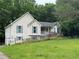 Exterior view of home with vinyl siding and large yard at 134 Summer Lake Dr, Dallas, GA 30157