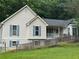 Close up exterior view of home with vinyl siding and large yard at 134 Summer Lake Dr, Dallas, GA 30157