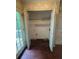 Hallway featuring a closet with open bi-fold doors and a door to a back deck at 134 Summer Lake Dr, Dallas, GA 30157