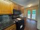Kitchen with a black gas range and light brown cabinets at 134 Summer Lake Dr, Dallas, GA 30157
