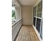 View of a wooden porch with vinyl siding and blue shutters at 134 Summer Lake Dr, Dallas, GA 30157
