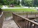 View of neighborhood from wooden walkway with railing at 134 Summer Lake Dr, Dallas, GA 30157