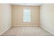 Cozy bedroom with neutral walls and soft carpet at 1666 Oakbrook Lake Dr, Norcross, GA 30093