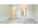 Spacious bedroom with neutral carpet and views to hall and bath at 1666 Oakbrook Lake Dr, Norcross, GA 30093