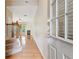 Inviting foyer with hardwood floors, staircase, and view into the living area with a fireplace at 1666 Oakbrook Lake Dr, Norcross, GA 30093