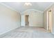 Main bedroom with vaulted ceiling and a ceiling fan and 2 entryways at 1666 Oakbrook Lake Dr, Norcross, GA 30093
