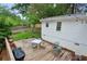 Wooden deck in a backyard with string lights and mature trees at 1680 Bristol Ne Dr, Atlanta, GA 30329