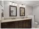 Bathroom with a double sink vanity with granite countertop and framed mirrors at 1680 Bristol Ne Dr, Atlanta, GA 30329