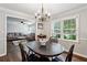 Open dining area with views into the living room, beautiful lighting, and wood floors at 1680 Bristol Ne Dr, Atlanta, GA 30329