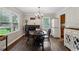 Dining room featuring wood floors, a chandelier, and natural light from a large window at 1680 Bristol Ne Dr, Atlanta, GA 30329