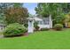 Charming home with a well-manicured lawn, inviting entryway, and lush landscaping at 1680 Bristol Ne Dr, Atlanta, GA 30329