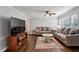 Cozy living room with wood floors, large television, and comfortable seating at 1680 Bristol Ne Dr, Atlanta, GA 30329