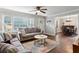 Bright living room featuring wood floors, a large window, and views of the dining area at 1680 Bristol Ne Dr, Atlanta, GA 30329
