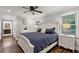 Spacious main bedroom featuring hardwood floors, neutral colors, and a ceiling fan at 1680 Bristol Ne Dr, Atlanta, GA 30329