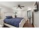Main bedroom with dark wood floors and a glimpse into an en-suite bathroom at 1680 Bristol Ne Dr, Atlanta, GA 30329