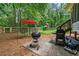 Private backyard features a grill, patio seating, wooden fence, and a playground set at 2750 Briarfield Way, Lawrenceville, GA 30043
