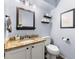 Cozy bathroom with granite countertop, soft blue paint, and classic fixtures at 2750 Briarfield Way, Lawrenceville, GA 30043