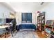 Comfortable bedroom features hardwood floors and storage cabinets behind curtain at 2750 Briarfield Way, Lawrenceville, GA 30043