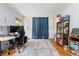 Functional bedroom design features hardwood floors and storage cabinets behind curtains at 2750 Briarfield Way, Lawrenceville, GA 30043