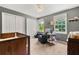 Comfortable bedroom featuring natural light, ceiling fan, carpeted floor and closet space at 2750 Briarfield Way, Lawrenceville, GA 30043