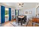 Elegant dining room with large windows, wood floors, and a classic ceiling fan at 2750 Briarfield Way, Lawrenceville, GA 30043