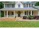 Inviting covered porch with classic columns and a cozy front entrance at 2750 Briarfield Way, Lawrenceville, GA 30043