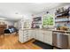 Spacious kitchen area with granite countertops, open shelving, and view into the living area at 2750 Briarfield Way, Lawrenceville, GA 30043