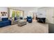 Comfortable living room showcases neutral tones, large windows, and cozy seating arrangements at 2750 Briarfield Way, Lawrenceville, GA 30043