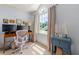 Bright work station space with natural light, large arched window and custom cabinets at 2750 Briarfield Way, Lawrenceville, GA 30043