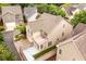 Aerial view of the house featuring a fenced backyard with artificial turf and a deck at 4916 Gathering Pl, Suwanee, GA 30024