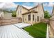 View of backyard with wooden deck, fenced yard, and artificial turf at 4916 Gathering Pl, Suwanee, GA 30024