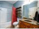 Bathroom with granite double vanity, tile flooring, and shower/tub combination at 4916 Gathering Pl, Suwanee, GA 30024