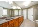 Bathroom with granite double vanity, tile flooring, stand up shower, and garden tub at 4916 Gathering Pl, Suwanee, GA 30024