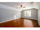 Bonus room with hardwood floors, ceiling fan, white trim and vaulted ceilings at 4916 Gathering Pl, Suwanee, GA 30024