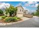 Home exterior with two-car garage, landscaping, and driveway at 4916 Gathering Pl, Suwanee, GA 30024