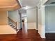 Hallway featuring hardwood floors, staircase and trimmed architectural features at 4916 Gathering Pl, Suwanee, GA 30024