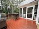 Back deck features a stainless steel grill, bar table with seating, and access to a screened porch at 111 Bexley Ln, Douglasville, GA 30134