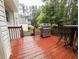 Back deck features a stainless steel grill, bar table with seating, and access to the backyard at 111 Bexley Ln, Douglasville, GA 30134
