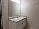 Bathroom featuring a vanity with a single sink and a large mirror, providing a functional space at 111 Bexley Ln, Douglasville, GA 30134