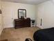 Bedroom features neutral carpeting, a window, and a dresser with a mirror at 111 Bexley Ln, Douglasville, GA 30134