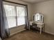 Bedroom with carpeting features vanity with mirror and large window with blinds at 111 Bexley Ln, Douglasville, GA 30134
