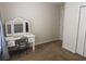 Bedroom showcasing a vanity with mirror and neutral carpeting at 111 Bexley Ln, Douglasville, GA 30134