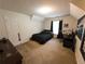 Bedroom showcasing neutral carpeting and window with black curtains at 111 Bexley Ln, Douglasville, GA 30134